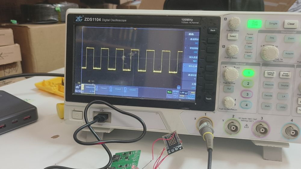 hardware validation bench with an oscilloscope